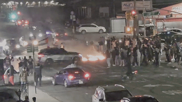 Cops hunt keffiyeh-wearing suspects in street takeover featuring Palestinian flag