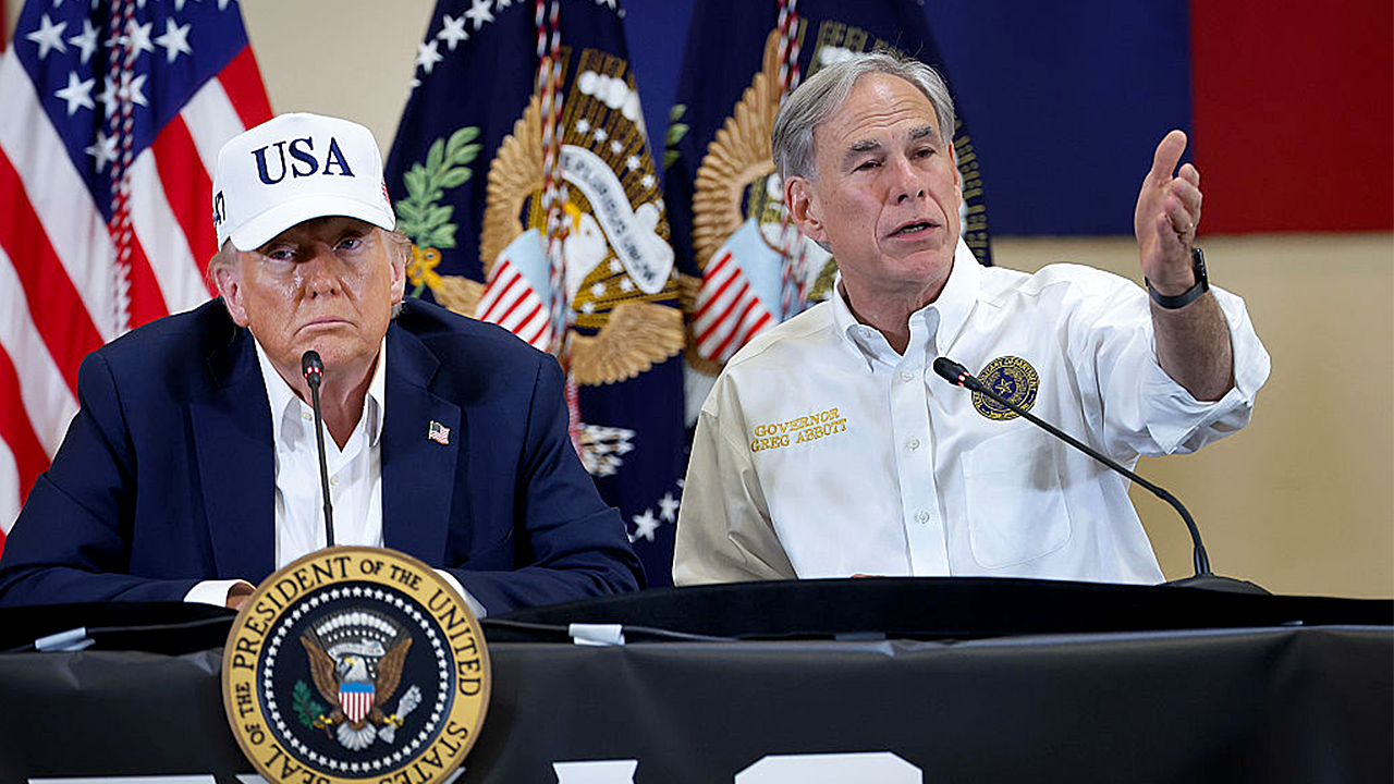 President Donald Trump and Texas Governor Greg Abbott participate in a round table event at the Hill Country Youth Event Center to discuss last week's flash flooding on July 11, 2025 in Kerrville, Texas. (Chip Somodevilla/Getty Images)