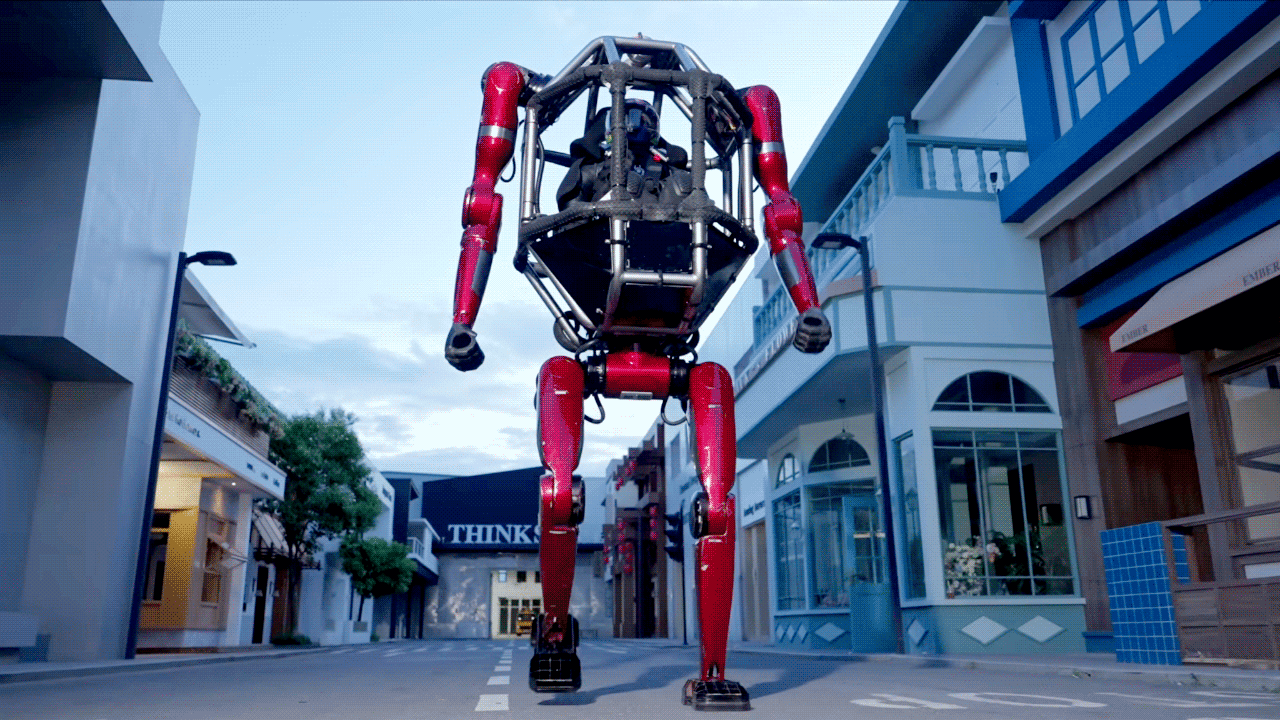 A person rides in the Unitree GD01 robot.