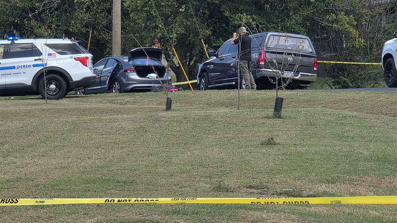 Police fatally shoot sword-wielding man after woman found trapped in car, officials say Police fatally shoot sword-wielding man after woman found trapped in car, officials say