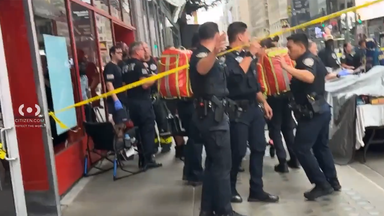Knife-wielding woman accused of stabbing 2 in Times Square before being shot by police
