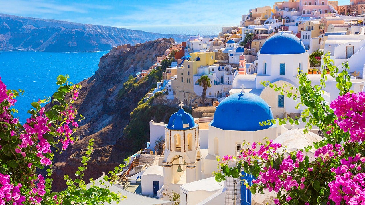 Santorini crowds driven by social media line up at Oia’s blue-domed churches for photos Santorini crowds driven by social media line up at Oia’s blue-domed churches for photos