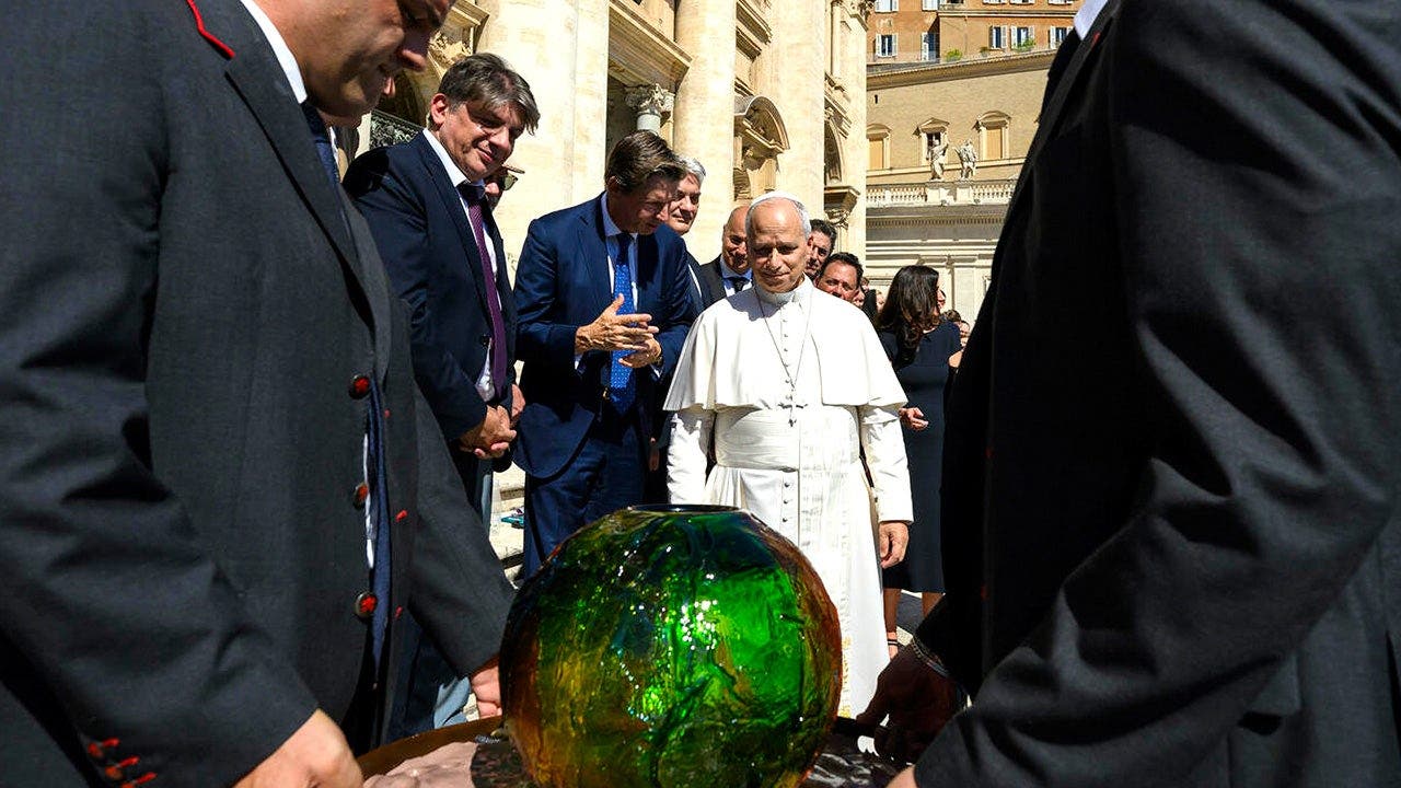 Pope Leo XIV receives 'symbolic’ sphere in charity's push for AI to 'protect human dignity'