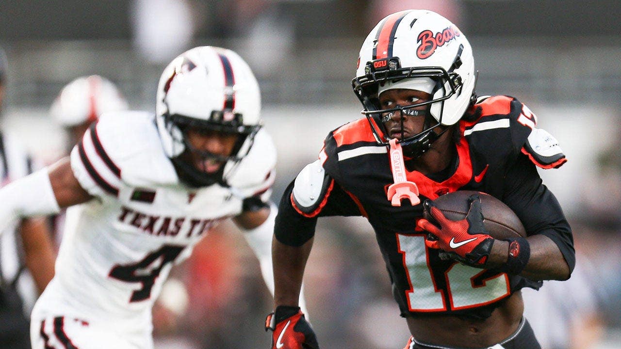 College football’s NIL and transfer portal chaos on display as nation’s top receiver holds absurd ceremony